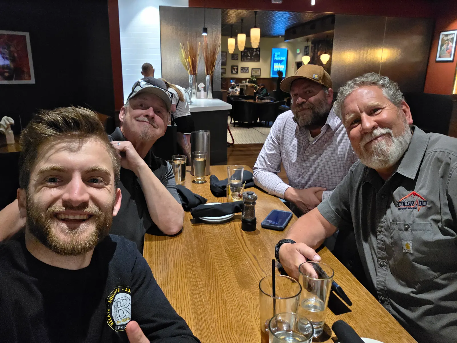 Noah at dinner with roofing contractors on the Roadshow