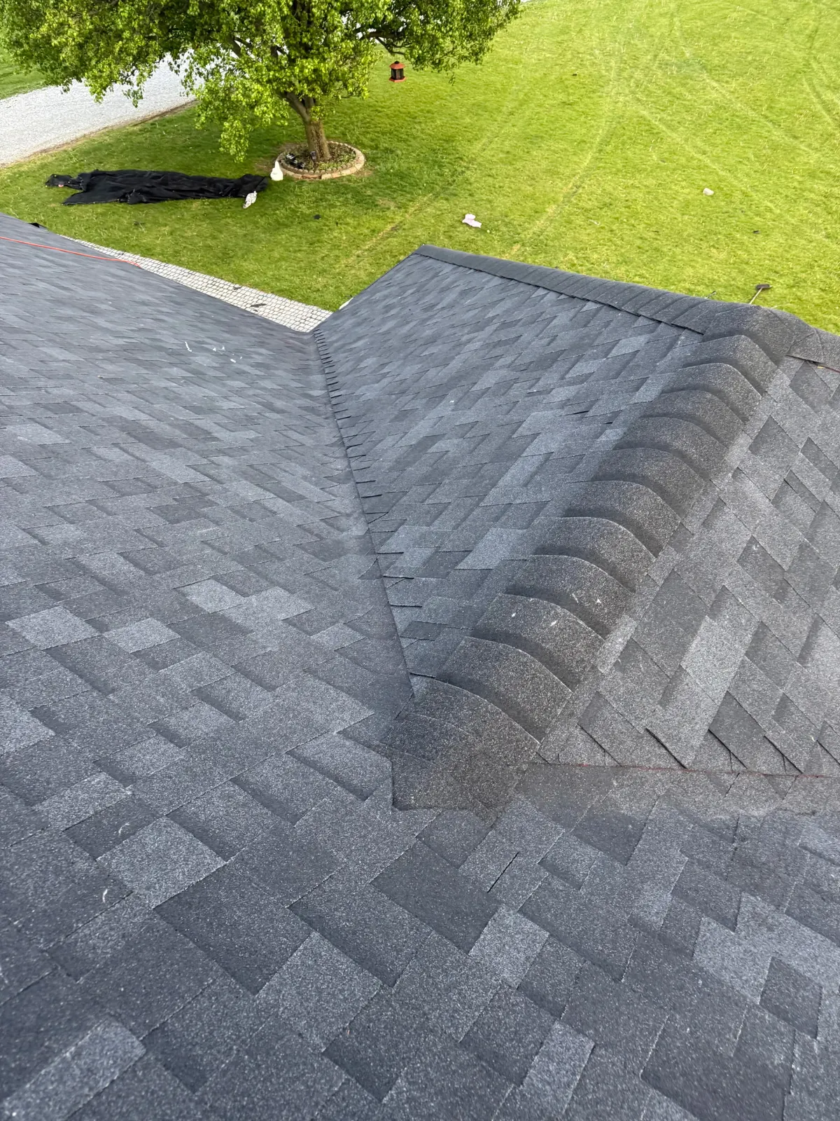 Newly installed gray architectural shingle roof