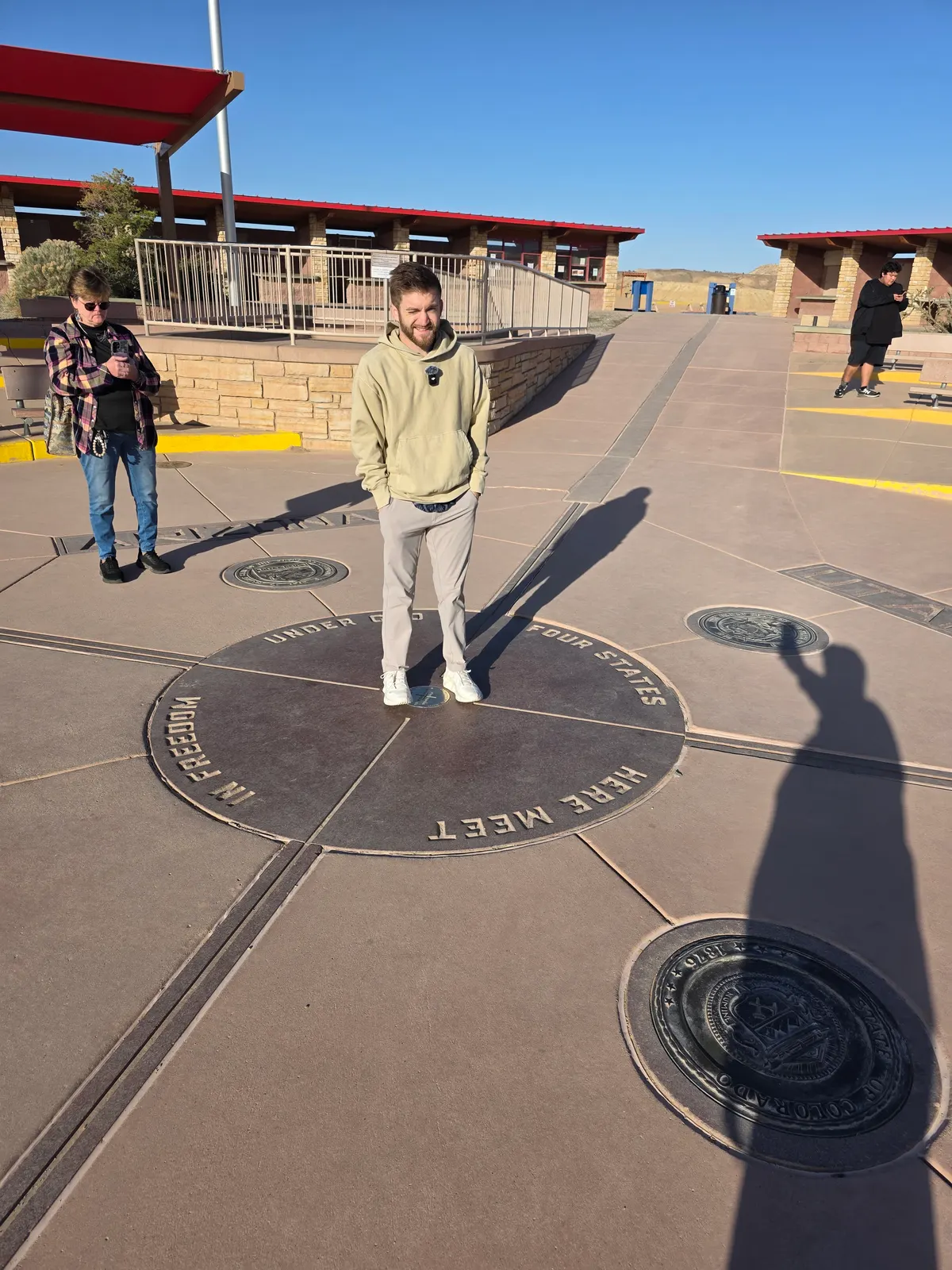 Noah standing on the Four Corners monument