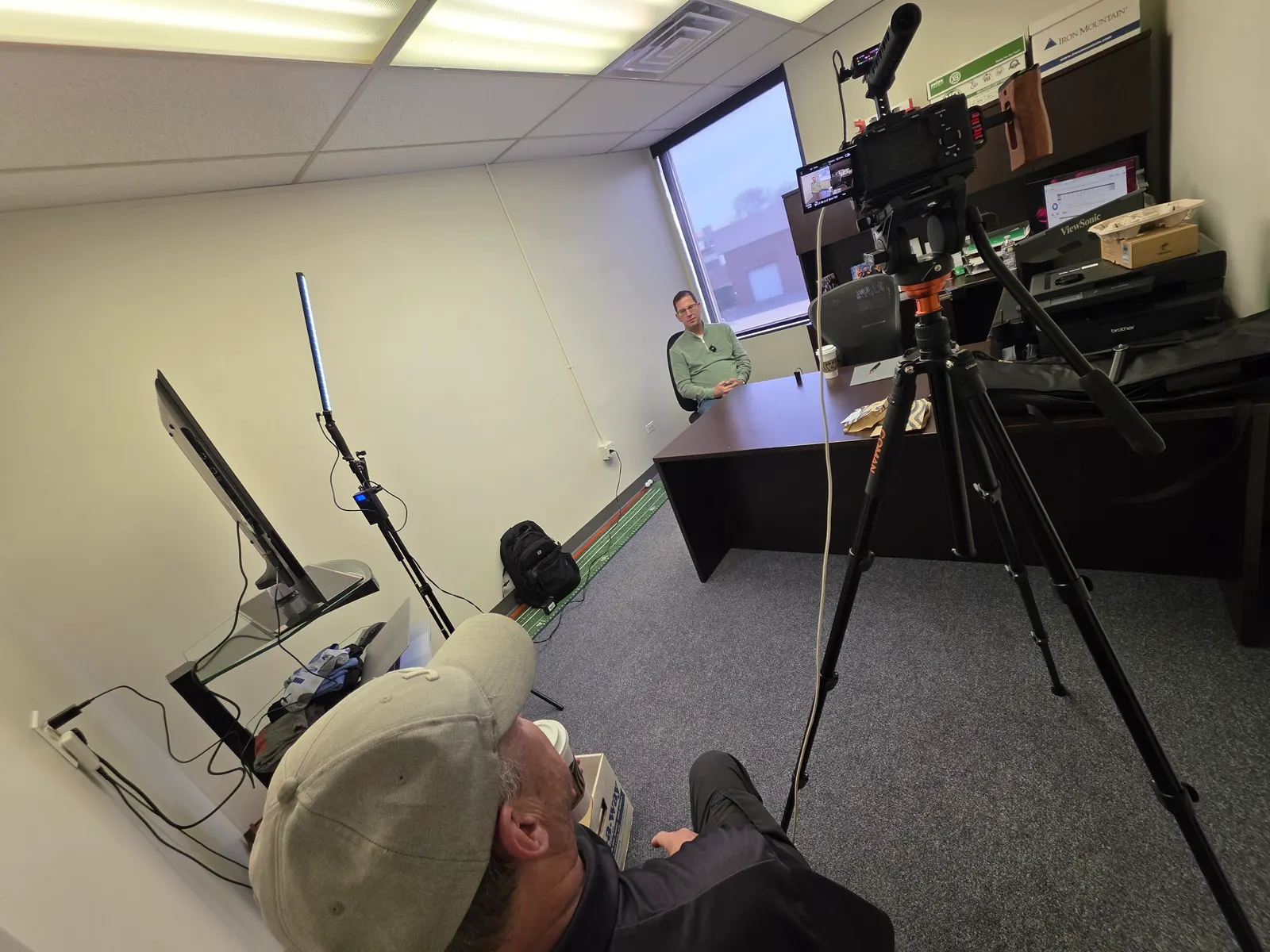 Two-camera setup recording a roofing contractor interview